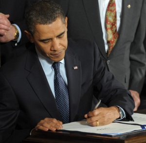 U.S. President Barack Obama signs the Veterans Health Care Budget Reform and Transparency Act, meant to streamline funding for Department of Veterans Affairs medical care in the East Room of the White House in Washington on October 22, 2009. With him from left are Speaker of the House Nancy Pelosi, D-CA, Sen. Daniel Akaka, D-HI, and Sen. Tim Johnson, D-SD. UPI/Roger L. Wollenberg (Newscom TagID: upiphotos970740) [Photo via Newscom]